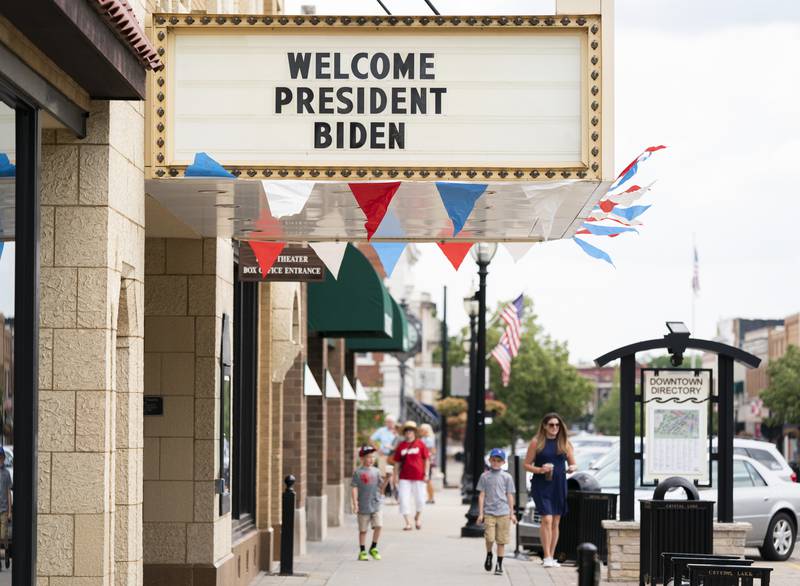 A sign on the Raue Center for the Arts in downtown Crystal Lake as President Joe Biden visits the city and McHenry County College on Wednesday, July 7 2021. Ryan Rayburn for Shaw Local
