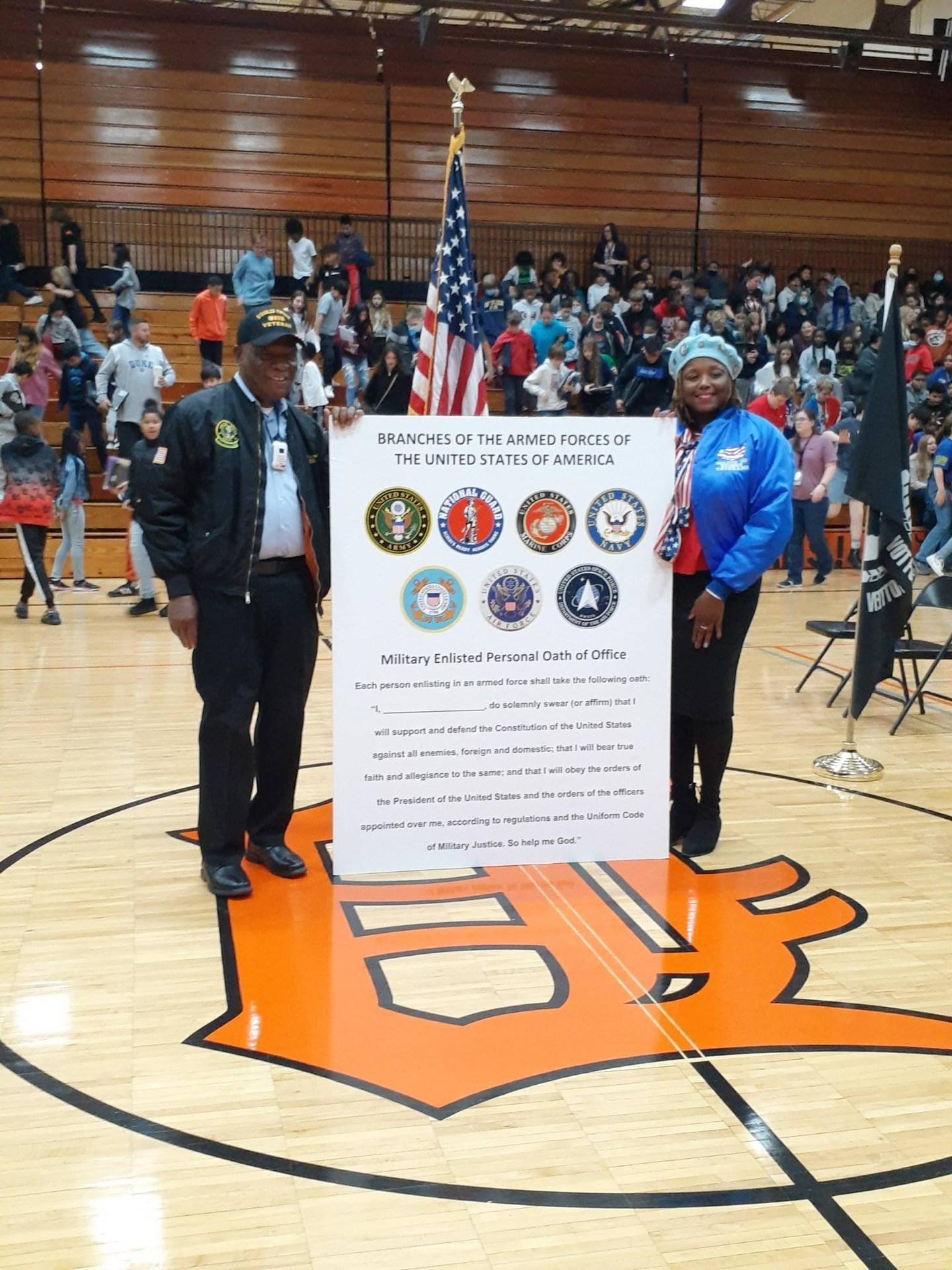 U.S. army veterans (from left) Daniel "Doc" Habeel, of DeKalb, and Nekohl Johnson helped out in November 2022 at DeKalb District 428′s Veterans Day assembly at Huntley Middle School. The school put on an American Patriotism Day program where Habeel gave away hundreds of American flags.