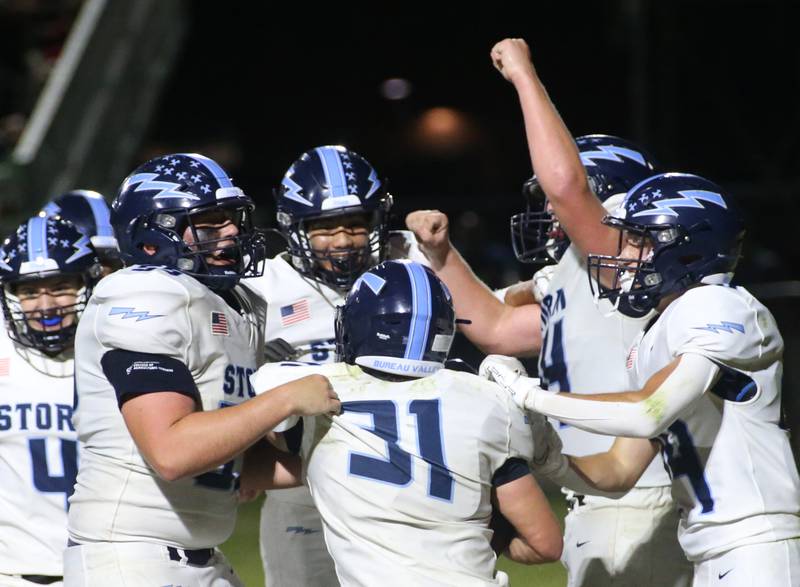 Members of the Bureau Valley football team celebrate with teammate Cameron Lemons (31) after scoring a touchdown against Hall on Friday, Sept 8, 2023 at Richard Nesti Stadium.