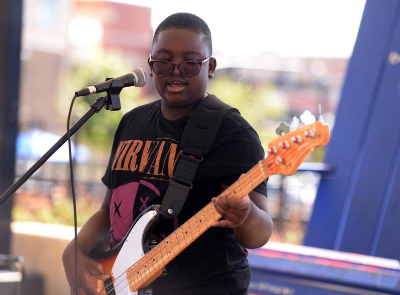 Members of the band Definition of Chaos including Louie Barrales-Saylor from the Jerry Evans School of Music in Wheaton perform during the Music on Main event held Saturday, Sept. 21, 2024.