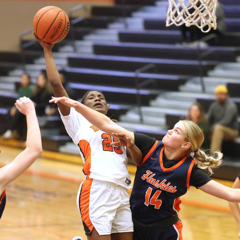 DeKalb’s Kezaria Mitchell shoots over Naperville North's Kendall Johnson Monday, Jan. 22, 2024, during their game at DeKalb High School.