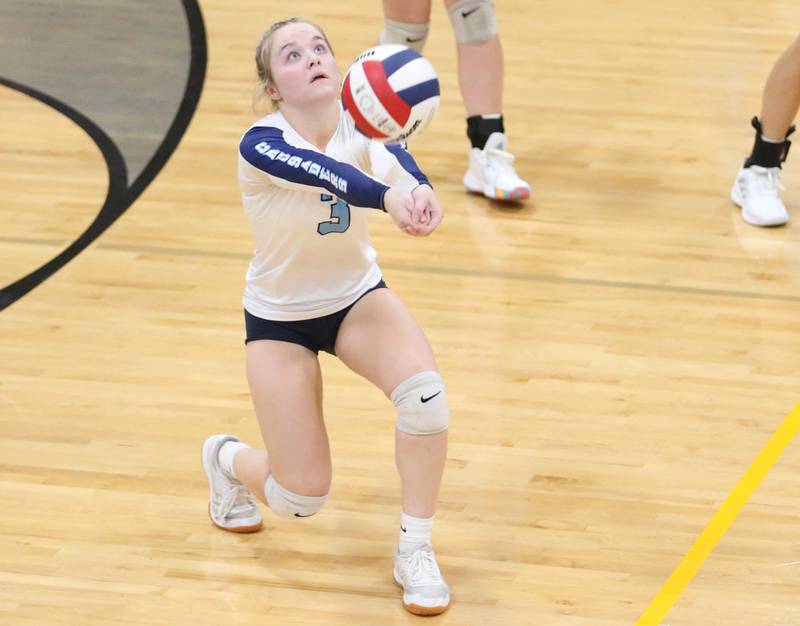 Marquette's libero Nora Rinearson returns a serve from Putnam County on Thursday, Sept 7, 2023 at Putnam County High School.