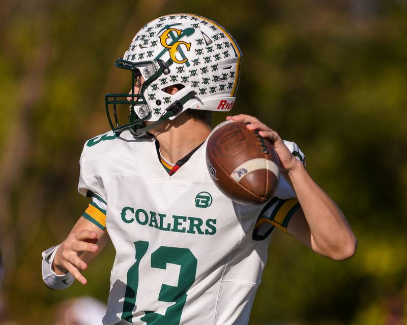 Coal City's Connor Henline (13) passes the ball while taking on Montini Catholic during the 4A quarterfinals game on Saturday Nov. 15, 2025, held at Montini Catholic High School.