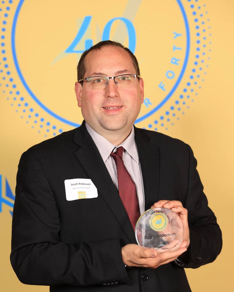 Scott Anderson poses with his 40 Under Forty award during the Illinois Valley Chamber of Commerce Champions of Change Awards Night on Thursday, April 10, 2025 at the Westclox Event Center in Peru.