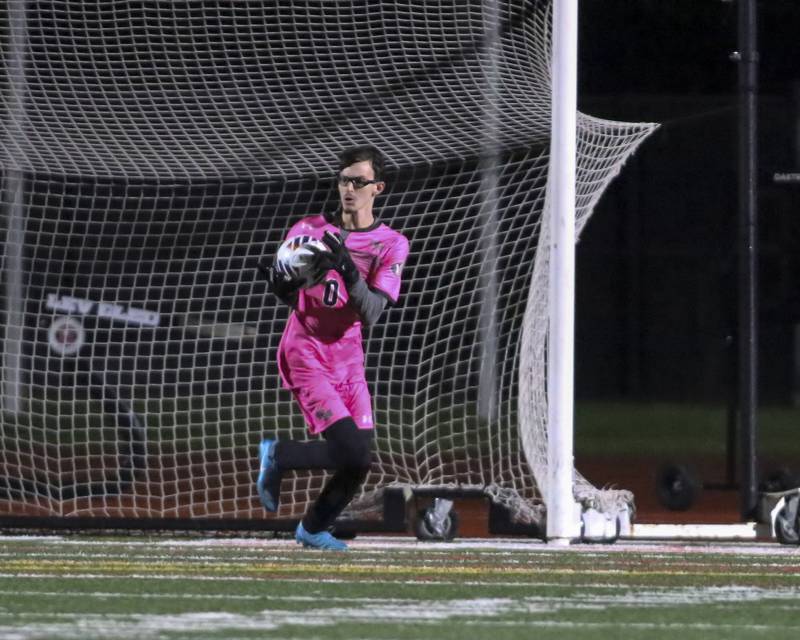 Oswego's Brayden Beverwyk (0) saves a goal during Class 3A Naperville Central Regional semifinal soccer match between Plainfield North at Oswego, Tuesday Oct 21, 2025.
