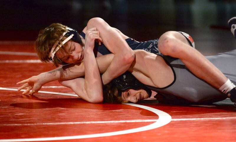 Morrison's Carson White (top) puts a hold on his Sandwich opponent in the 150-pound match at a triangular meet with Oregon on Friday, Jan. 31, 2025 in the Blackhawk Center at Oregon High School.