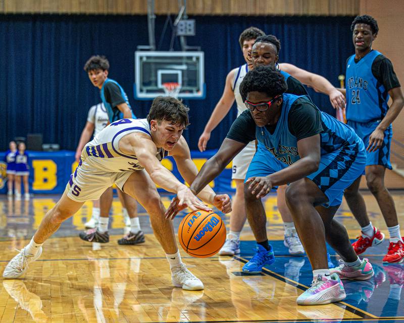 Lota Onwuameze (34) of IMSA and Payton Twait (24) of Serena reach for ball during the quarterfinals of the Little Ten Conference Tournament on Monday, Feb. 2, 2026 at Somonauk High School in Somonauk.
