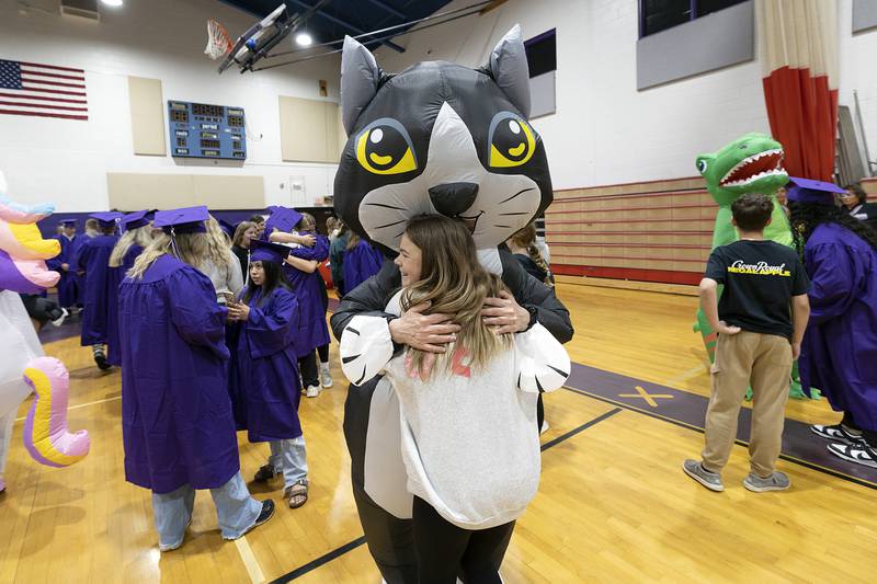 Liz Detig hugs a student Wednesday, May 21, 2025, at Reagan Middle School.