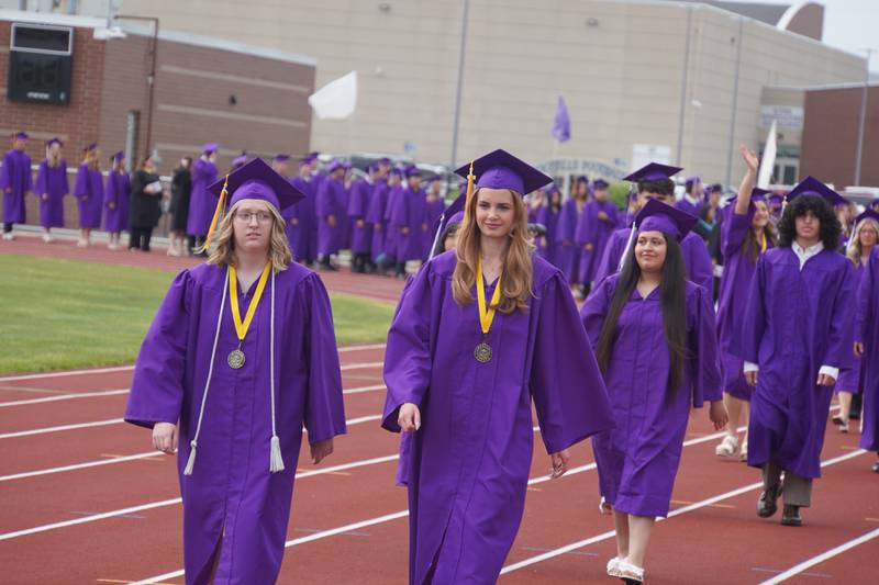 Rochelle Township High School graduating seniors walk to the football field on Saturday, May 23, 2026.