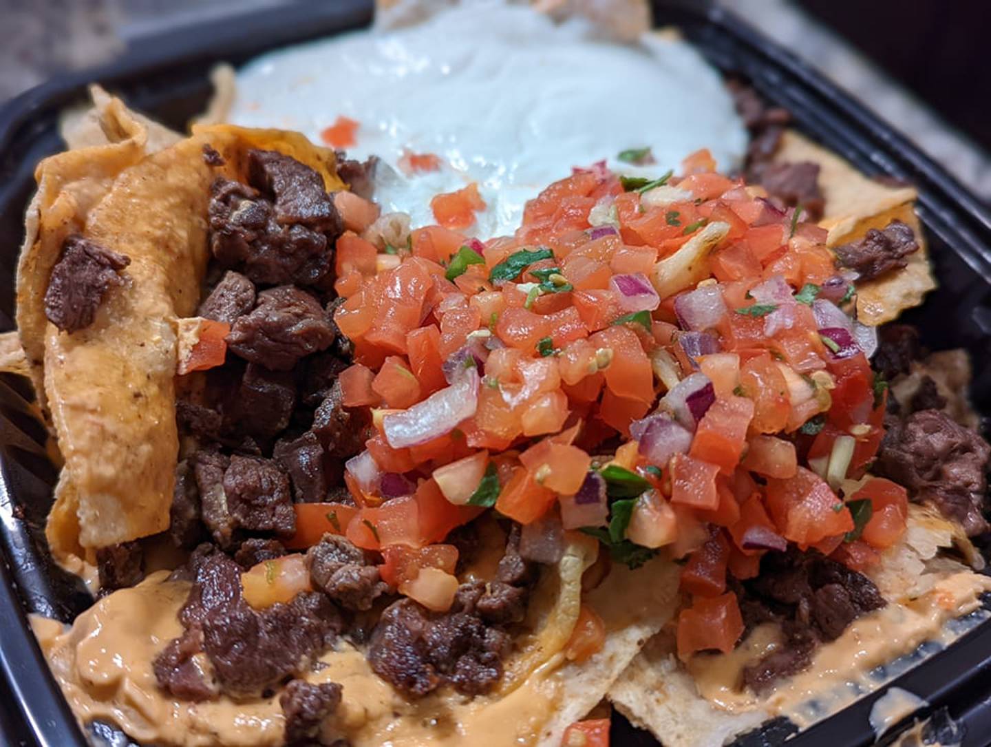 The nachos from Skooter's RoadHouse in Shorewood were delicious with plenty of toppings to go around; ours came with jalapeños and guacamole.