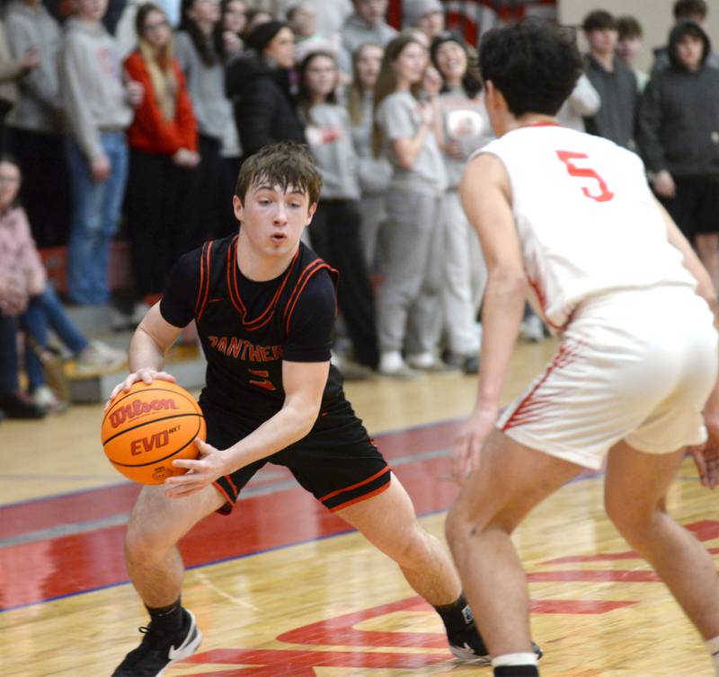 Erie-Prophetstown's Max Milem (5) makes a move to the basket against Oregon's Benito Olade (5) during Monday, Feb. 24, 2025 2A regional action at the Blackhawk Center in Oregon.