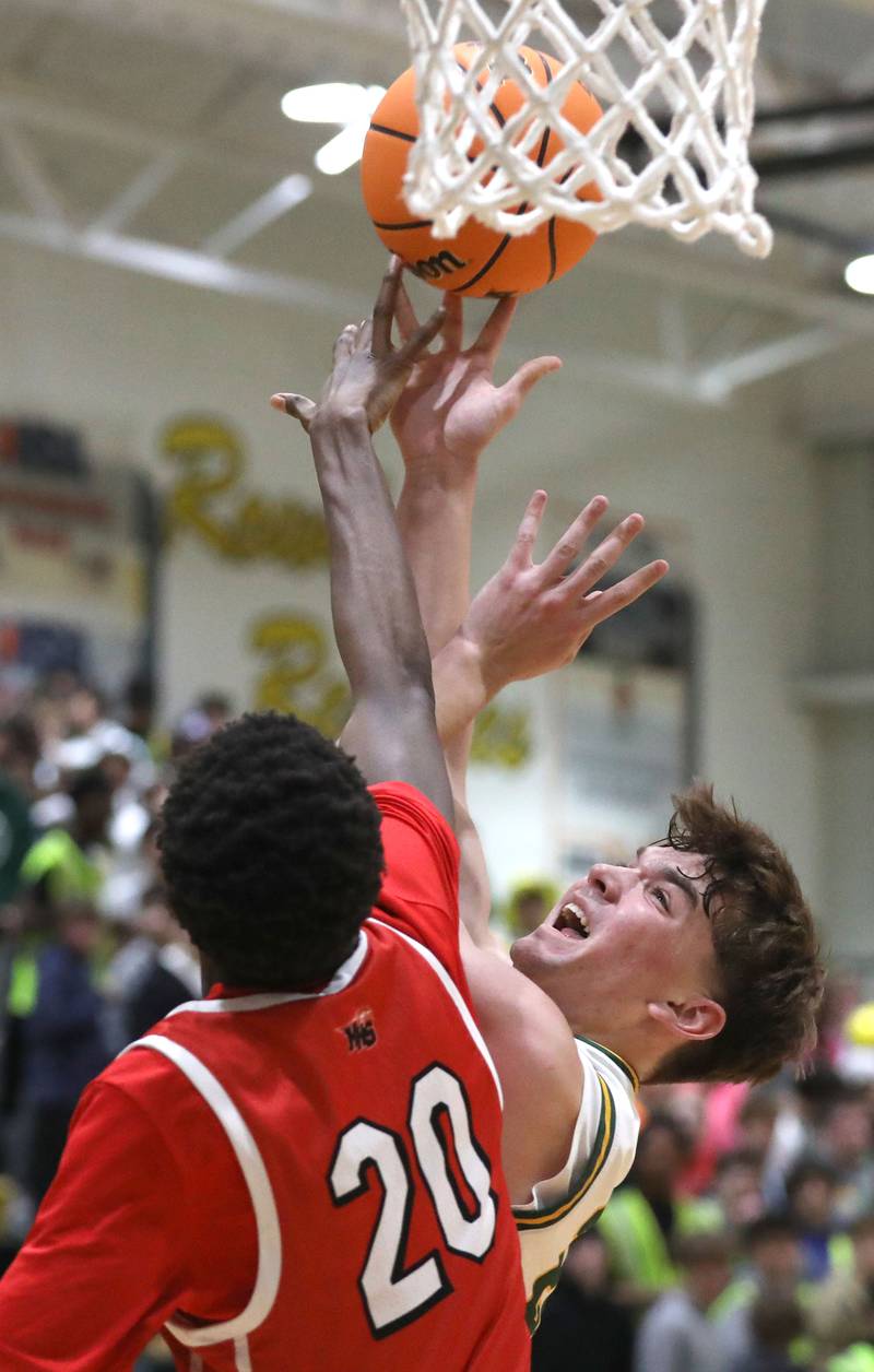 Crystal Lake South's Nick Stowasser is fouled by Huntley's Isaiah Onu during a Fox Valley Conference boys basketball game on Friday, Jan. 30, 2026, at Crystal Lake South High School.