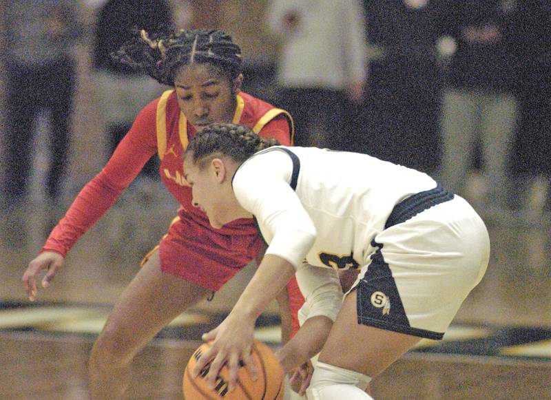 Joslynn James gets the ball from a Rocl Island player. Western Big 6 conference champions Sterling hosted Rock Island in girls basketball. The action took place Thursday, February 13, 2025 at Musgrove Fieldhouse at SHS.