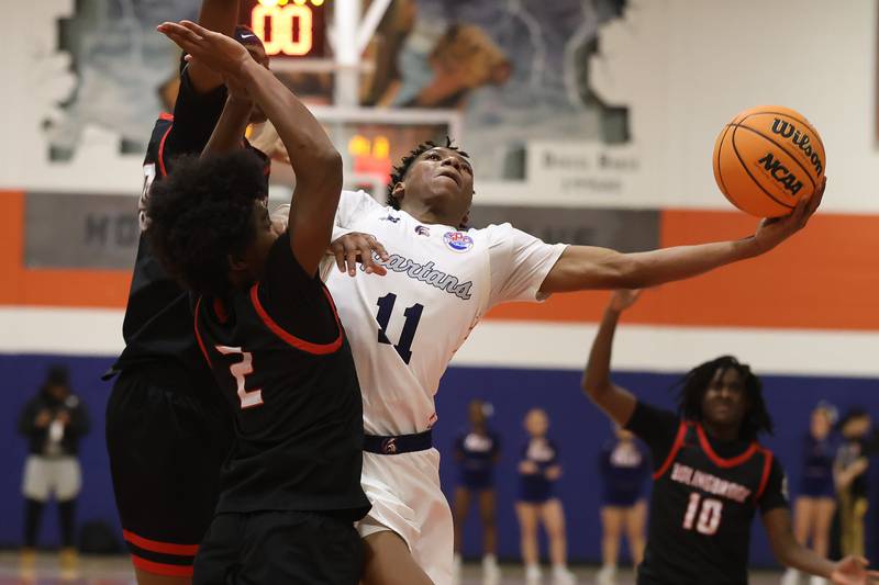 Romeoville's Jamarri Fears stretches for the layup against Bolingbrook on Tuesday, Dec. 2, 2025 in Romeoville.