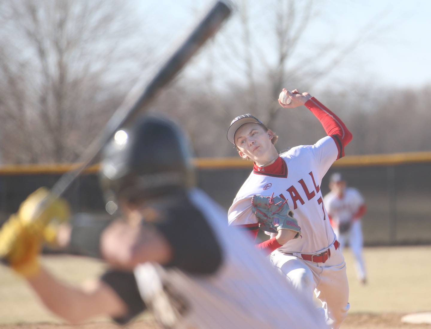 Hall pitcher Izzaq Zrust fires a pitch to Putnam County's Johnathon Stunkel on Monday, March 17, 2025 at Putnam County High School.