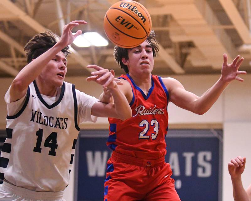 West Chicago's Joseph Trigueros (14) and Glenbard South's Joey Villa (23) battle for a free ball during the game on Friday Jan. 3, 2025, held at West Chicago High School.