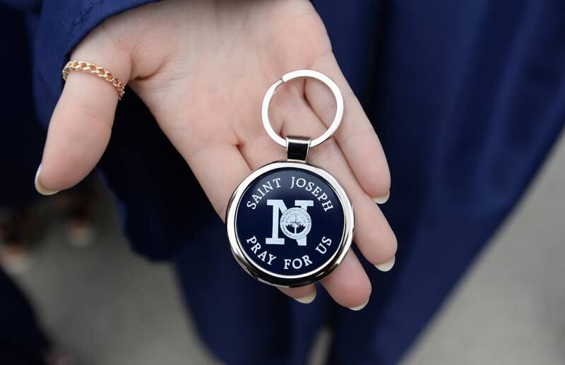 Nazareth class of 2022 students receive a St. Joseph key chain at their graduation Sunday May 22, 2022.