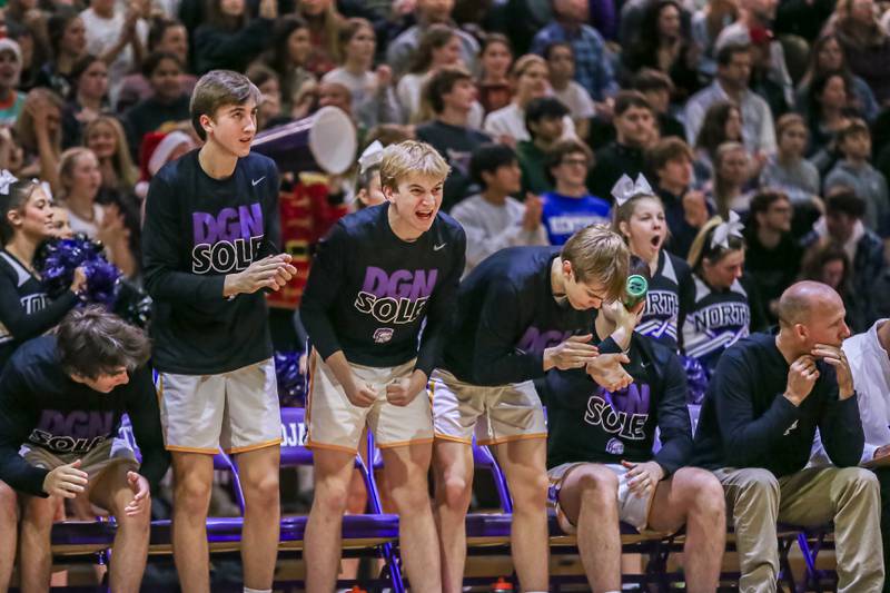 Downers Grove North's bench cheers on the team during basketball game between Downers Grove South at Downers Grove North. Dec 16, 2023.