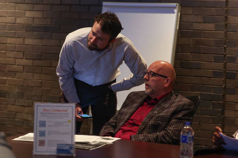 Hudson Hollister, cofounder of the Courthouse Preservation Partnership, left, and Quinn Adamowski, Historic Preservation Commission member, talk before the start of the the Joliet City Council Meeting on Tuesday, Sept. 19, in Joliet.