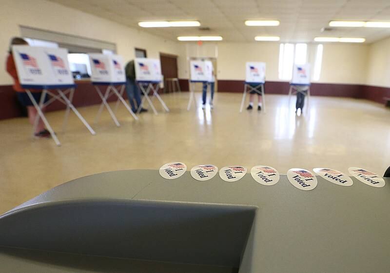 "I Voted" stickers alline on top of a voting machine at the Ladd Community Center on Tuesday April 6, 2021.