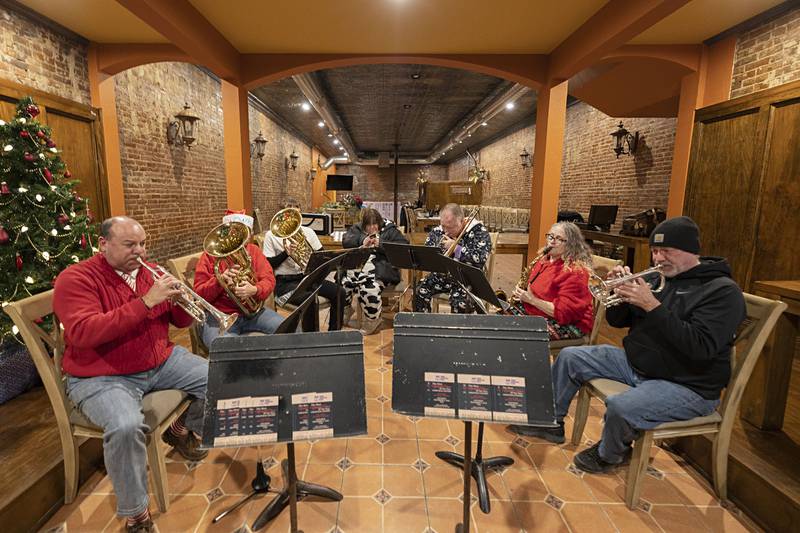 Members of the Dixon Municipal Band play a set at Salamandras Friday, Dec. 5, 2025, in Dixon. The band will be performing a full set at The Dixon on Saturday at 7:30pm.