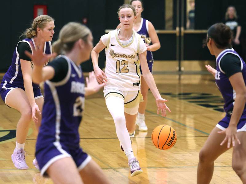 Sycamore's Sadie Lang pushes the ball ahead among four Rochelle defenders during their game Friday, Dec. 6, 2024, at Sycamore High School.