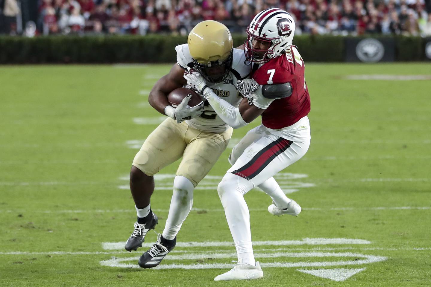 South Carolina defensive back Nick Emmanwori (7) tackles Wofford running back Ryan Ingram, left, for a loss during the first half of an NCAA college football game Saturday, Nov. 23, 2024, in Columbia, S.C. (AP Photo/Artie Walker Jr.)