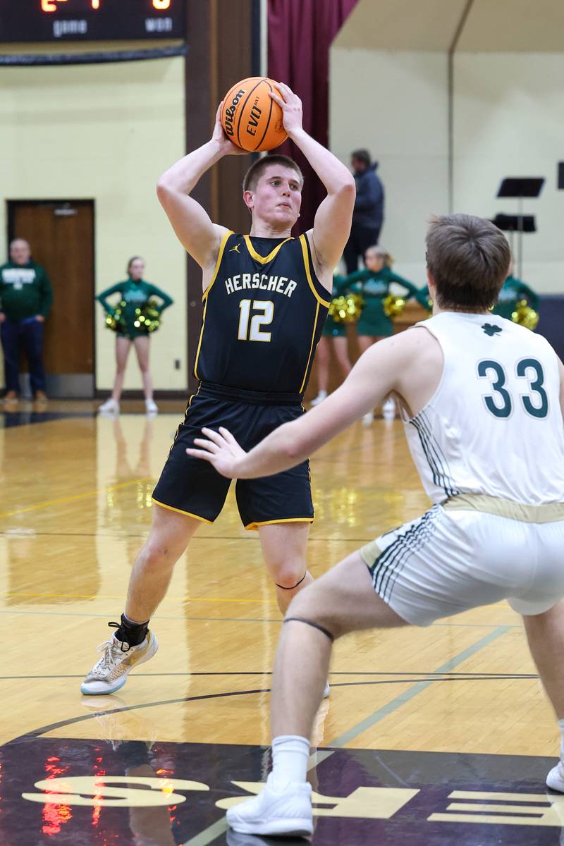 Herscher Gavin Hull looks to pass during the Tigers' 71-42 loss to Bishop McNamara in the IHSA Class 2A Herscher Regional semifinal on Wednesday, Feb. 25, 2026.