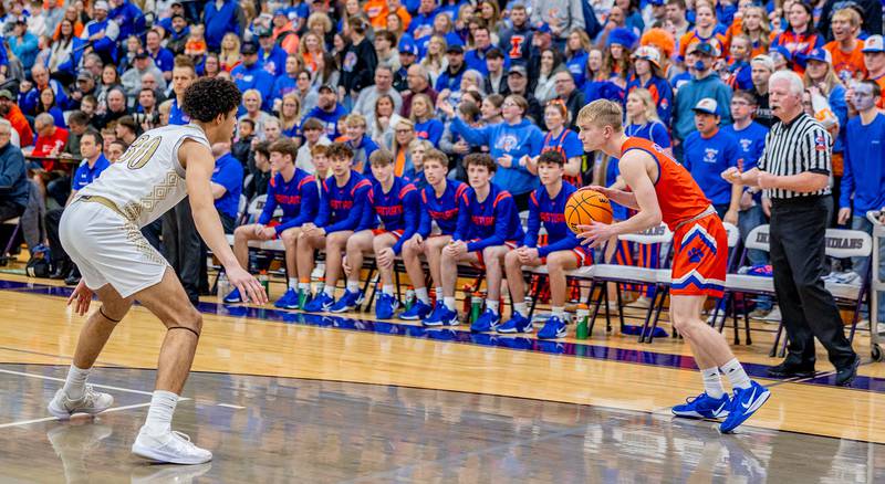Senior guard Adam Awender looks to break the Pecatonica press during the first half of the sectional final on Friday, March 7, 2025.