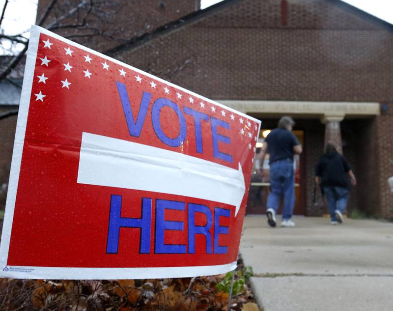 People walk to vote on Tuesday, Nov. 5, 2024, at the Johnsburg Public Library.