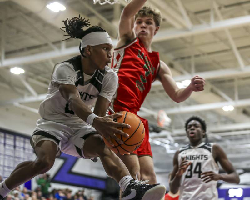 Kaneland's Isaiah Gipson (2) passes on a drive underneath the basket during their Plano Christmas Classic semi-=final basketball game against La Salle-Peru on Monday, Dec 29, 2025, in Plano.