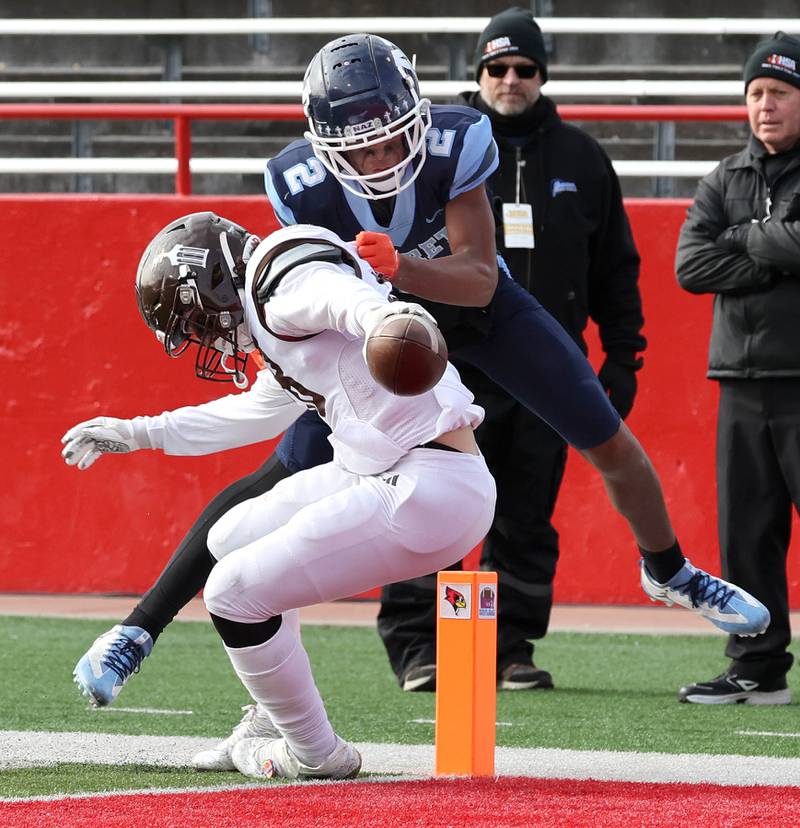 Joliet Catholic's Nate Magrini stretches the ball across the goal line as Nazareth's Garrett Reese tries to stop him Saturday, Nov. 25, 2023, during their IHSA Class 5A state championship game in Hancock Stadium at Illinois State University in Normal.