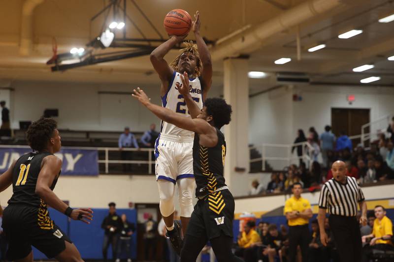 Joliet Central’s Jaylin Murphy puts up a contested shot against Joliet West.