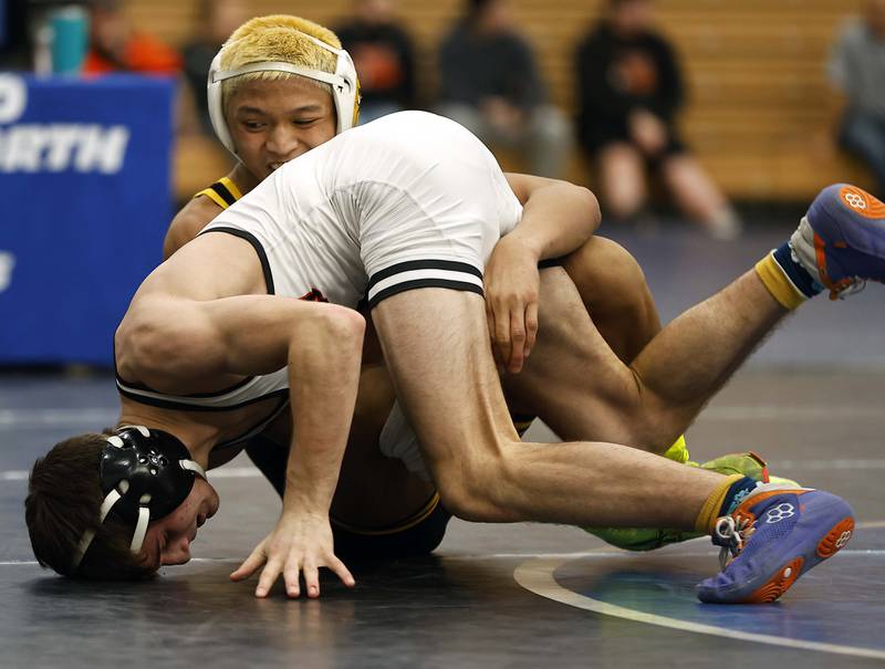 St. Charles East’s Liam Aye wrestles Glenbard North’s Kalani Khiev at 126-lbs at the 2025 DuKane Boys Varsity Tournament Saturday, Jan. 25, 2025 in St. Charles.