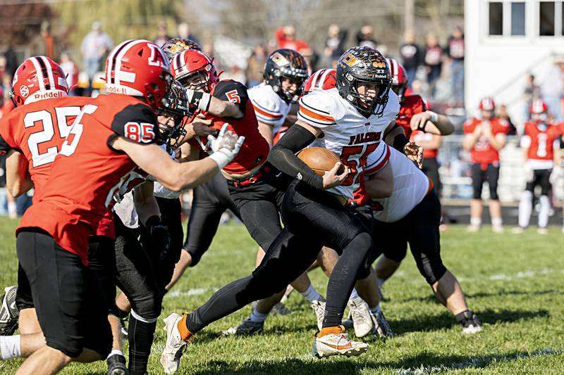 FCW’s Kelser Collins picks up yards against Amboy Saturday, Nov. 4, 2023 in the 8-man semifinal game in Amboy.