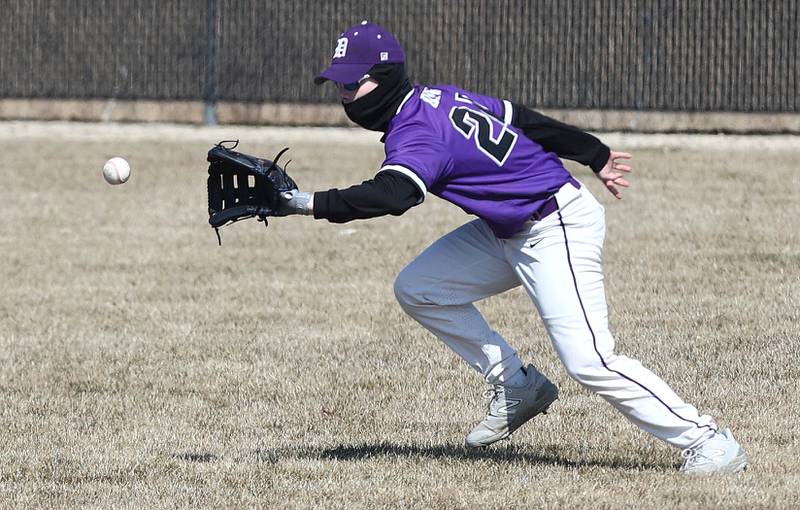 Dixon’s Kyan Adkins makes a play in the outfield during their game against DeKalb Tuesday, March 28, 2023, at DeKalb High School.