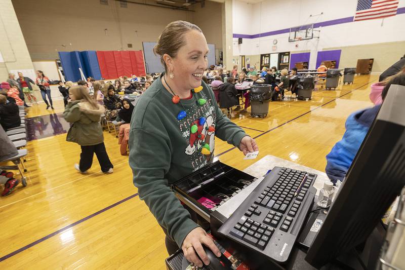Joann Heckert rings up lunches at Jefferson School Tuesday, Dec. 17, 2024, in Dixon. Destiny McElhinney of Dixon is leading a fundraiser with the goal of wiping out student lunch debt at the school.