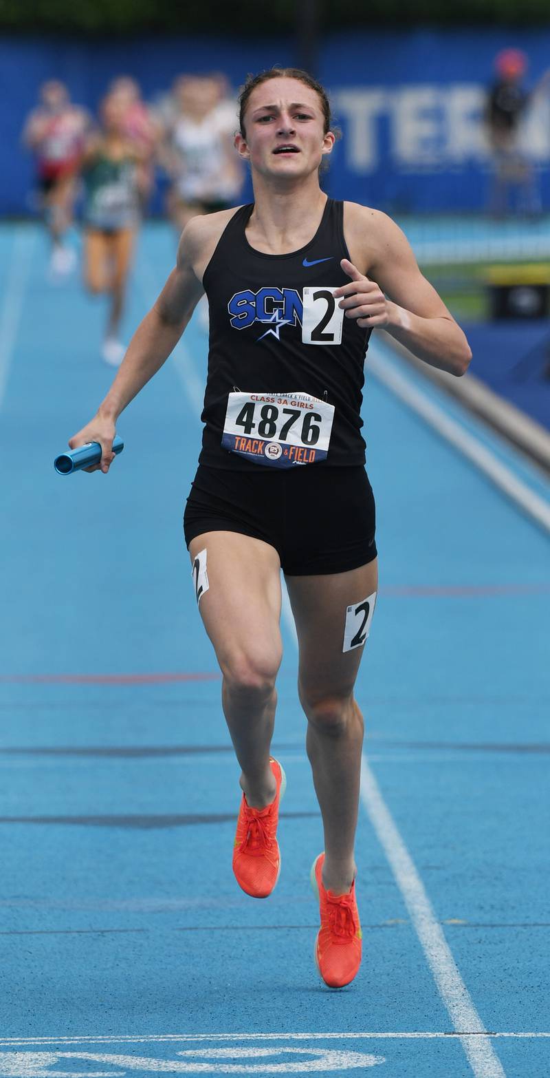 St. Charles North anchor Kara Glenn crosses the finish line as the North Stars win the 3,200-meter relay during the Class 3A girls track and field state meet at Eastern Illinois University on Saturday, May 23, 2026 in Charleston.