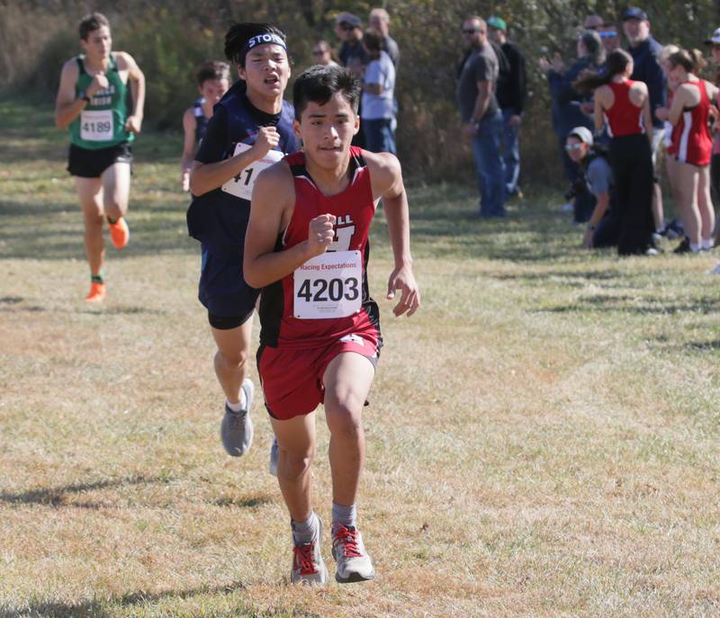 Hall's Eri Martinez-Prado rand Bureau Valley's Owen Larkin run in the Class 1A Regional Cross Country boys race on Saturday, Oct. 22, 2022 at the Seneca FFA Farm in Marseilles.