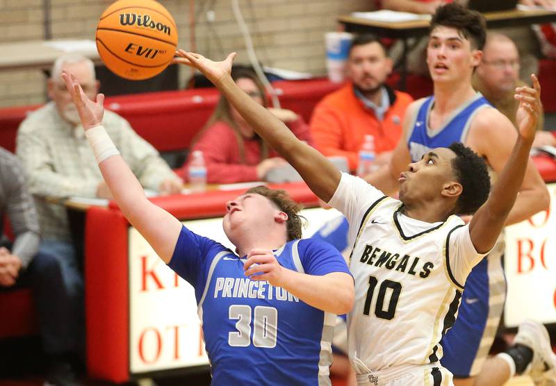 Oak Forest's Nieko LeFlore breaks a up a pass intended for Princeton's Jordan Reinhardt during the Dean Riley Shootin' The Rock Thanksgiving Tournament on Tuesday, Nov. 26, 2024 in Kingman Gym at Ottawa High School.