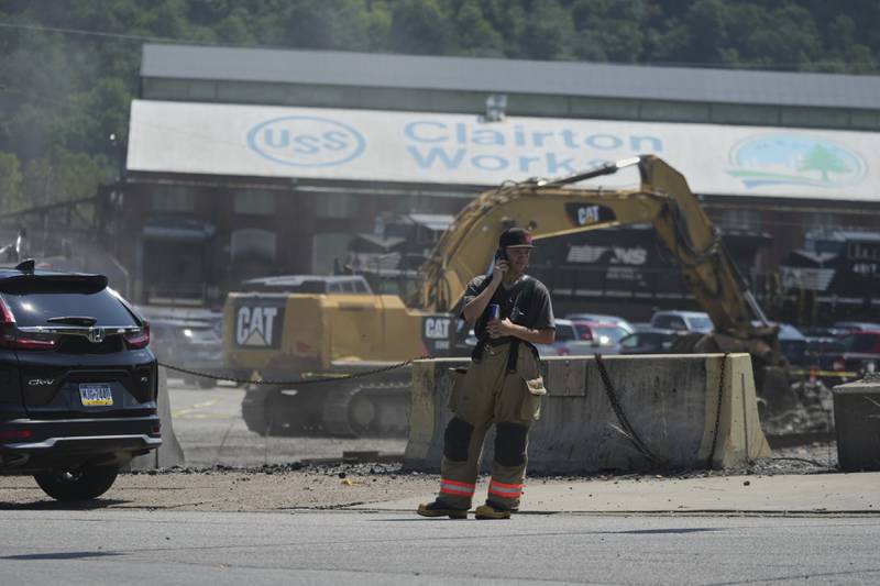 An emergency crew is seen after an explosion at the Clairton Coke Works, a U.S. Steel coking plant, Monday, Aug 11, 2025, in Clairton, Penn.