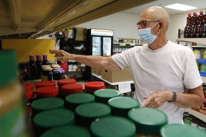 Bob Pierce, president of Woodstock Food Pantry, goes over his inventory on Wednesday, Aug. 4, 2021, in Woodstock. The pantry was in need of items that included tuna fish, paper towels, tissues, toilet paper, ketchup and syrup but also accepts monetary donations, which it uses to purchase food and items from the Northern Illinois Food Bank.
