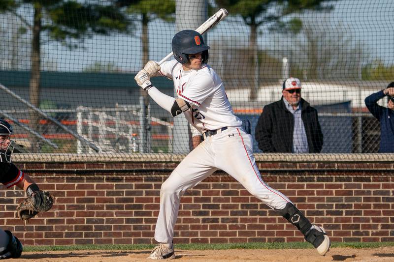 Oswego’s Tyler Stack (25) stands at the plate during a baseball game against Minooka at Oswego High School on Tuesday, April 18, 2023.