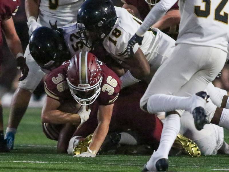 Morris' Jacob Swartz (36) dives for yards against Joliet West on Sept. 1, 2023.