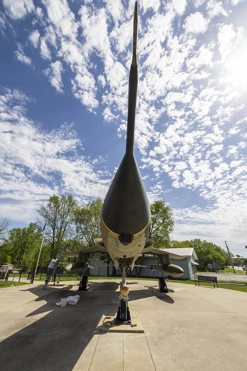 Bob Balayti of Balayti Painting works on sprucing up the Vietnam era jet Wednesday, May 8, 2024, on display at Veterans Memorial Park in Dixon. Balayti, a Navy veteran himself, is volunteering his time for the project.