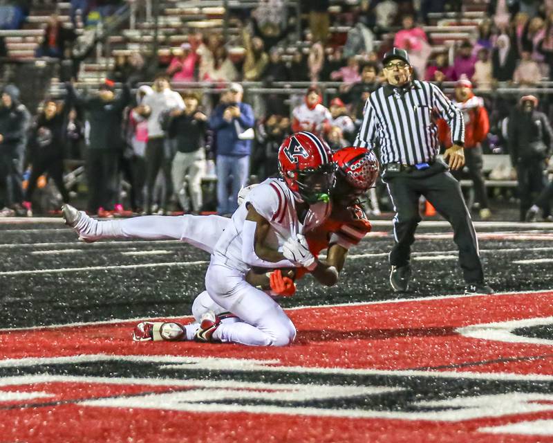 Yorkville's Jayden Ruth (4) comes down with a touchdown catch during football game between Yorkville at Bolingbrook Friday, Oct 24, 2025 in Bolingbrook.
