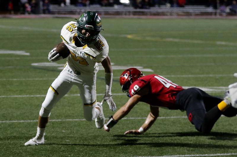 Crystal Lake South's AJ Demirov tries to run away from the tackle attempt of Huntley's Ari Fiebig during a Fox Valley Conference football game on Friday, Sept. 29, 2023, at Huntley High School.