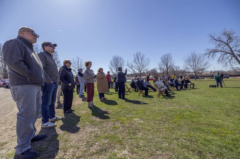Local residents and officials watch Tuesday, April 8, 2025, as a ceremony marking the start of Project Rock is being held in Page Park in Dixon.