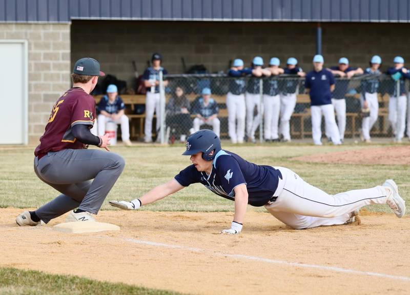 Bureau Valley senior Tyler Birkey dives back to first base against ROWVA in Tuesday's season-opener in Manlius. The visiting Cougars won 5-1.