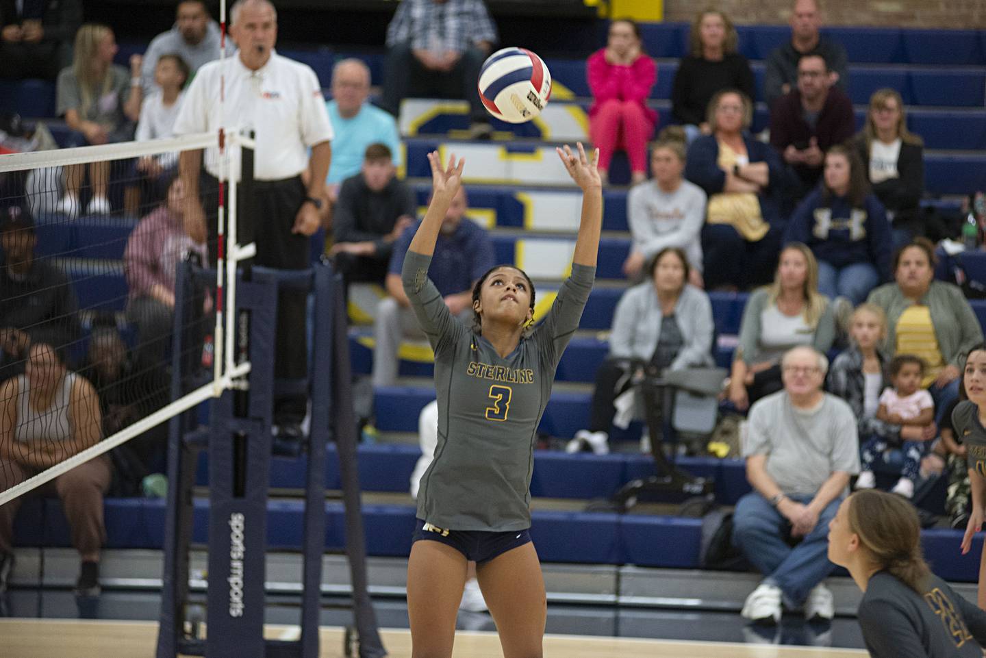 Sterling’s Delali Amankwa sets the ball against United Township Thursday, Oct. 6, 2022.